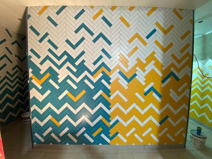 herringbone pattern in commercial tile with yello, dark green and yellow colour